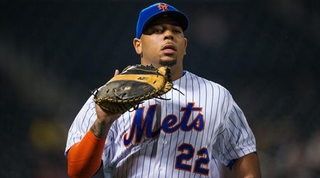 The Mets' Dominic Smith looks on against the