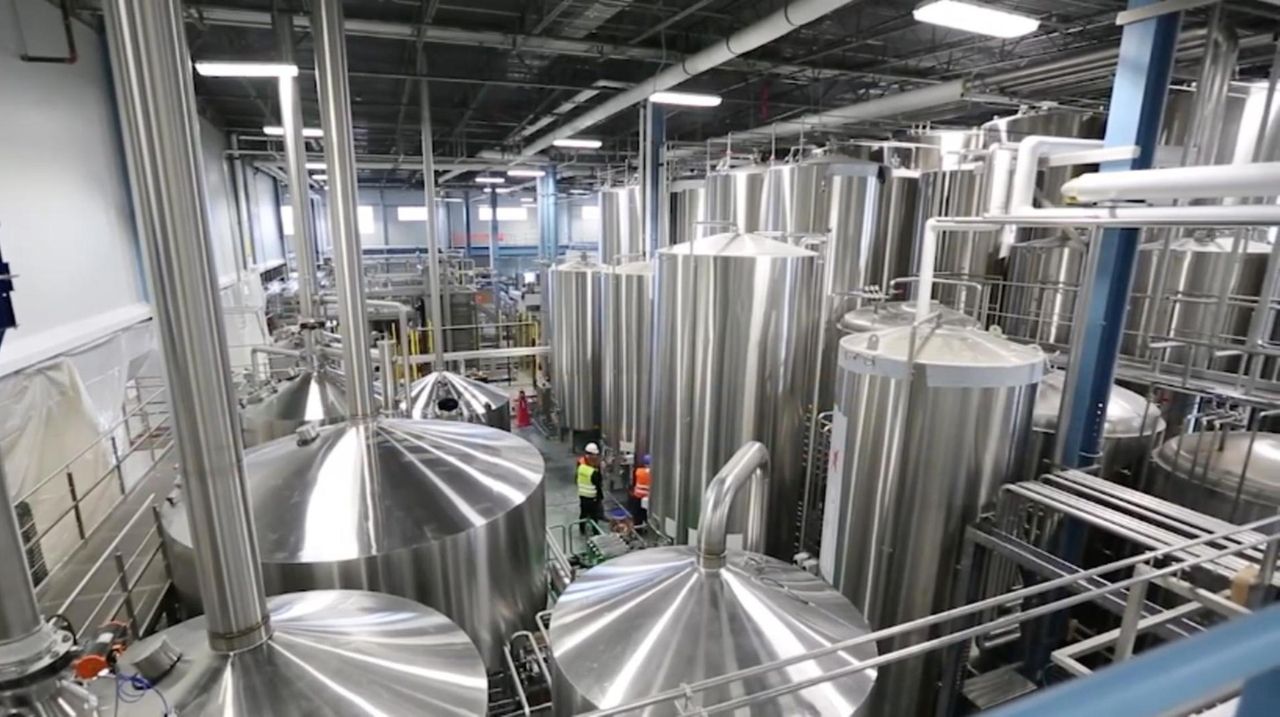 Blue Point Brewing Co. employees make preparations to
