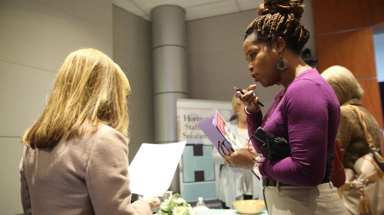 Job seeker Althea Woodhouse, right, of Uniondale, speaks