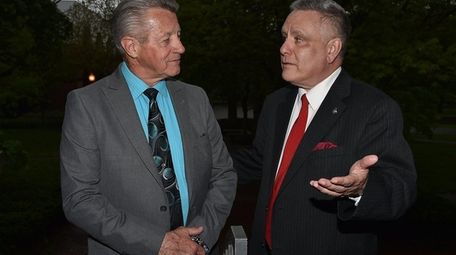 Tom Daly, left, the former dean of Dowling's