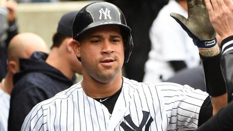 Yankees catcher Gary Sanchez is greeted in the