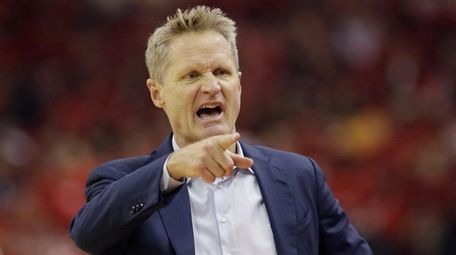 Warriors head coach Steve Kerr signals during the