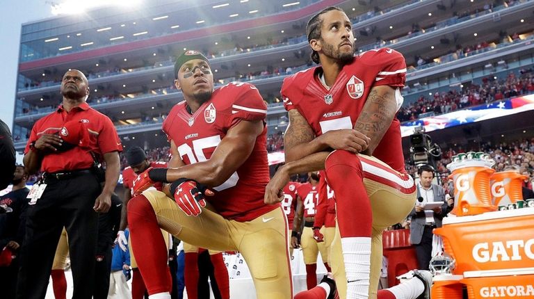 49ers safety Eric Reid (35) and quarterback Colin