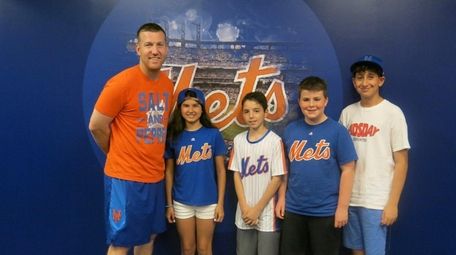 New York Mets' Todd Frazier with Kidsday reporters