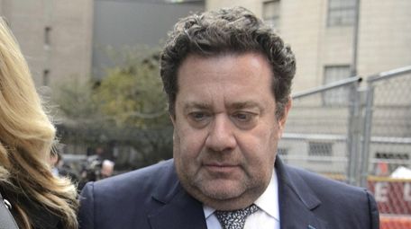 Murray Huberfeld, exits a federal courthouse in lower