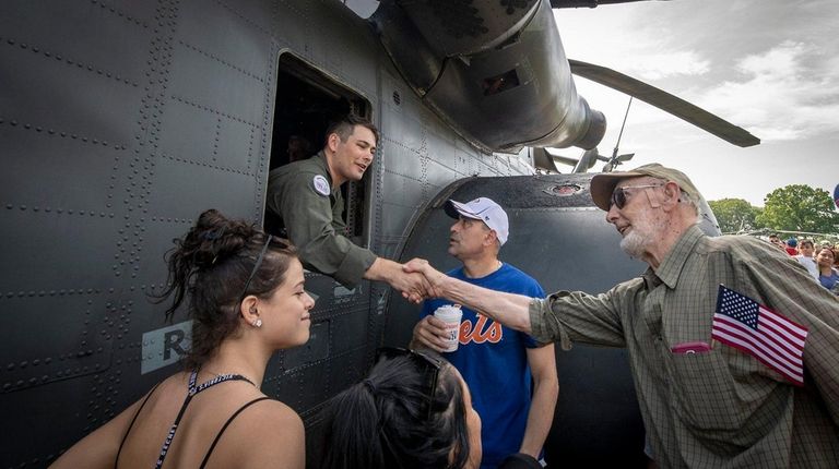 Gerhard Osterhof of Baldwin Harbor thanks Naval Aircrewman
