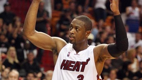 Miami Heat's Dwyane Wade incites the fans during