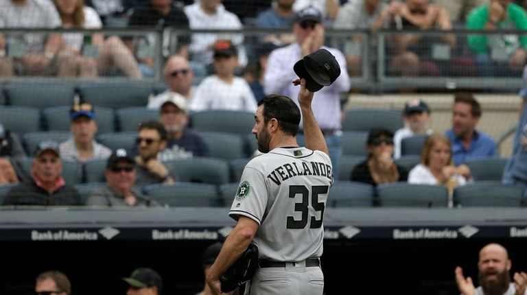 Houston Astros starting pitcher Justin Verlander tips his