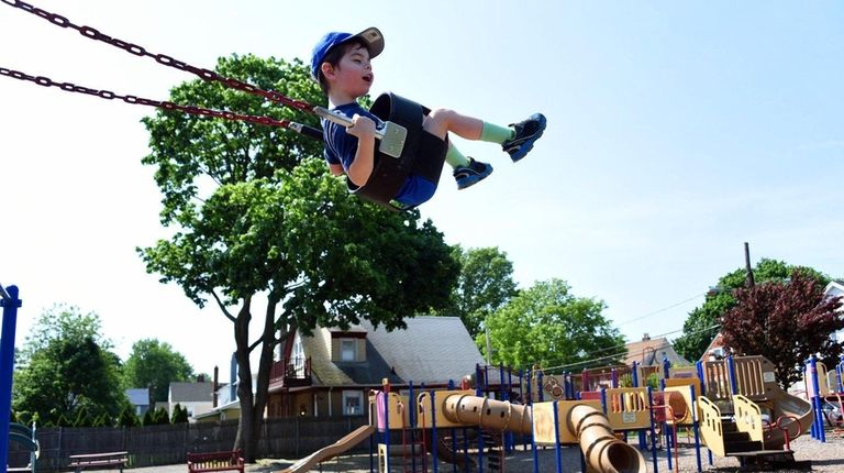 Harry Tully, 3, of Floral Park, plays at