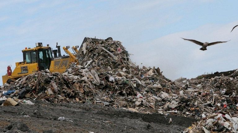 A plow is used to move waste at
