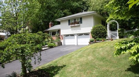 This four-bedroom Glen Cove split-level is listed for