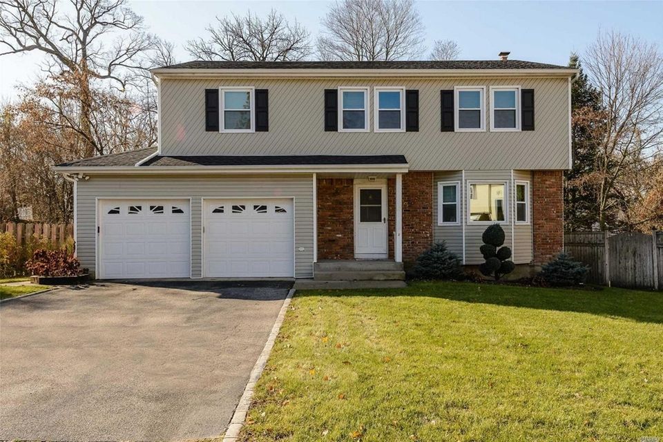 This Glen Cove Colonial includes four bedrooms and