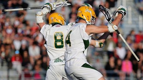 Ward Melville's Matthew Grillo and Zach Hobbes celebrate