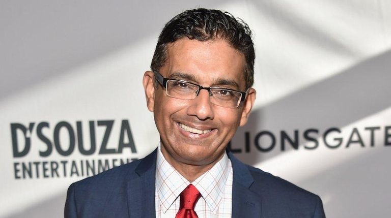 President Donald Trump on Thursday pardoned Dinesh D'Souza,