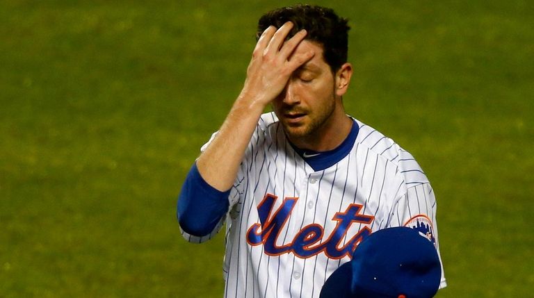 Mets pitcher Jerry Blevins walks to the dugout