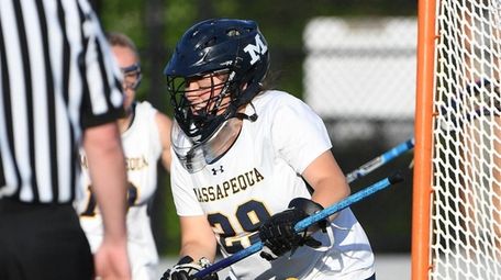 Goalie Sophia Cardello leads the defense for Massapequa.