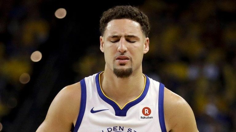 Warriors guard Klay Thompson reacts after standing up