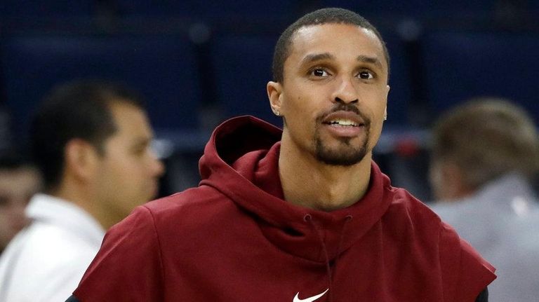 The Cavaliers' George Hill prepares to shoot during