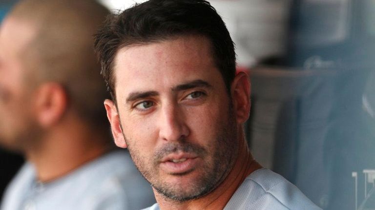 Reds starting pitcher Matt Harvey waits to batin