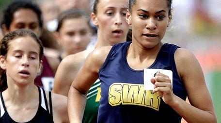 Shoreham-Wading River's Katherine Lee enters the turn in