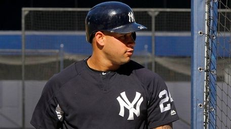 Yankees catcher Gary Sanchez looks on during batting