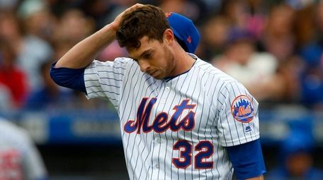 Steven Matz of the Mets walks to the