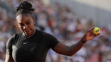 Serena Williams prepares to serve to Germany's Julia