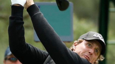 Phil Mickelson hits a drive on the 18th