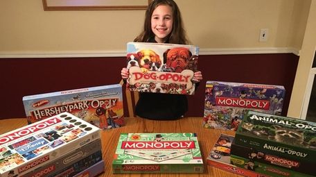 Kidsday reporter Dana Stumpf and her Monopoly collection.