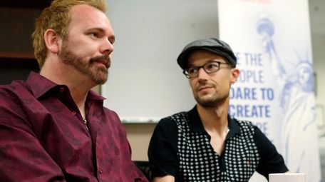 Charlie Craig, left, and David Mullins talk on
