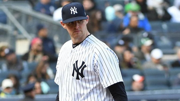 Yankees pitcher Jordan Montgomery walks to the dugout