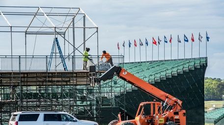 A tent and stands are being put up