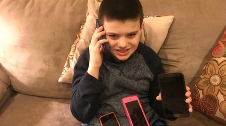 Kidsday reporter Matthew Vilbig enjoys his hand-me-down phones.