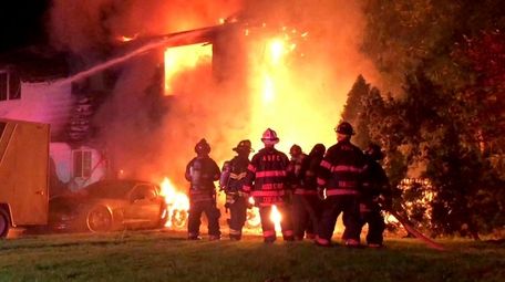 Firefighters respond to a house fire early Monday