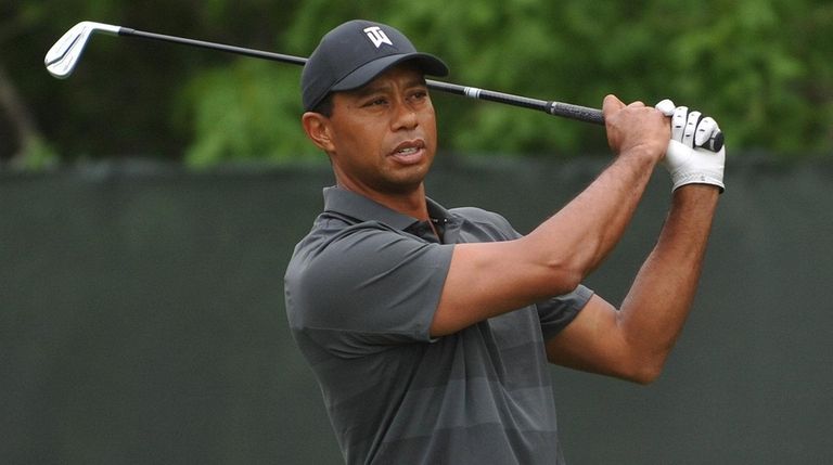 Tiger Woods prepares to tee off from the