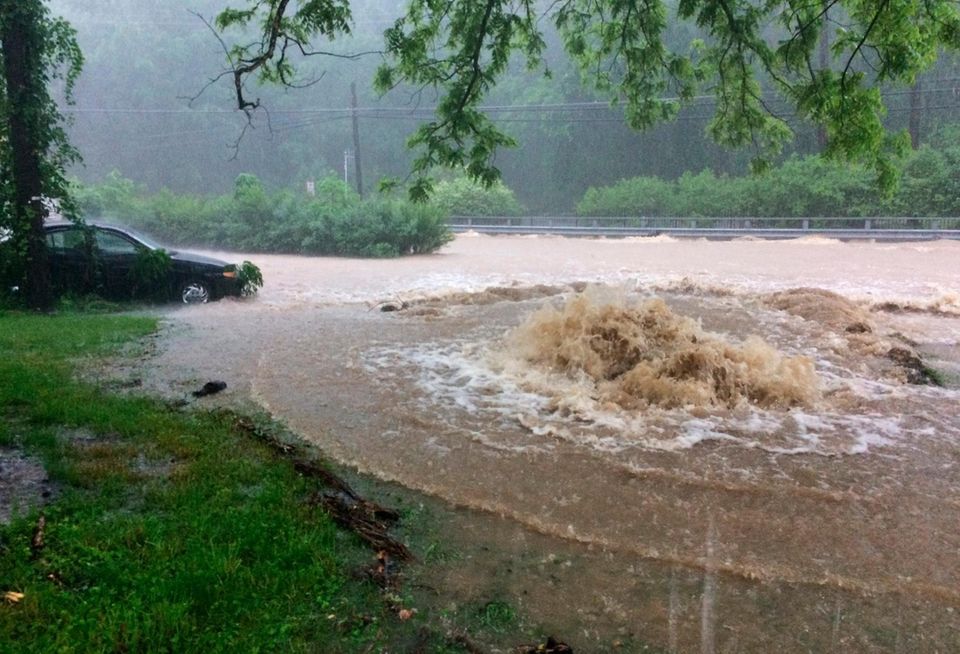 Flash flooding covers Rogers Avenue and Main Streets