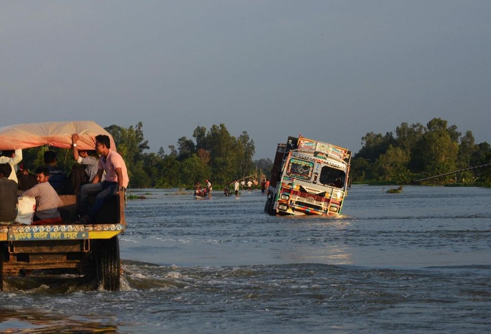 Indian villagers traveling at the back of a