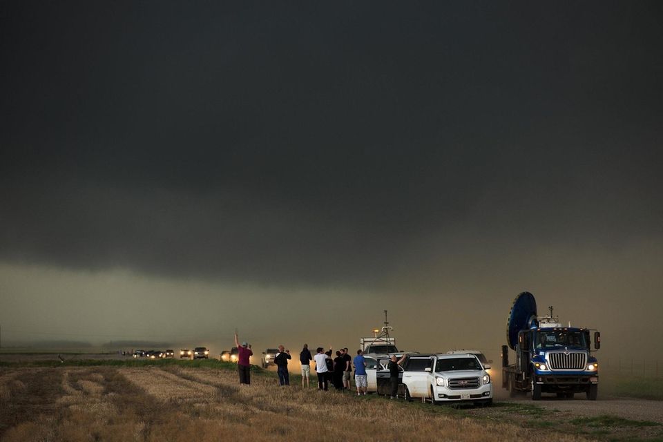 A caravan of storm chasers arrive on the