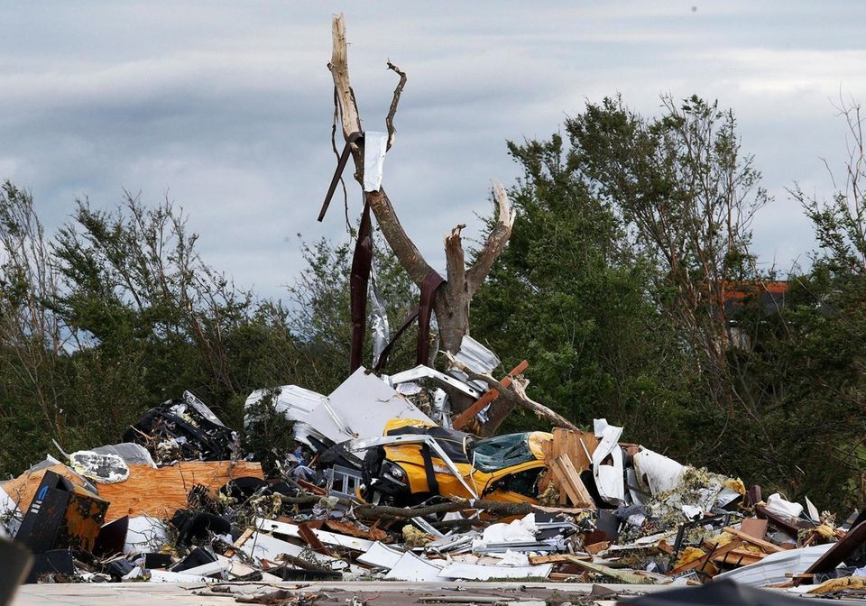 Cars and debris is seen piled up at