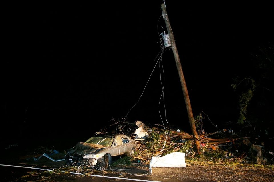 A car is part of the tornado debris