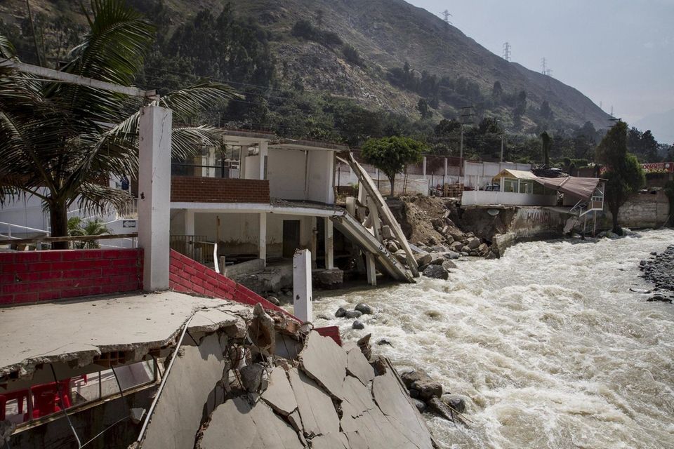 A restaurant destroyed by massive floods stands in