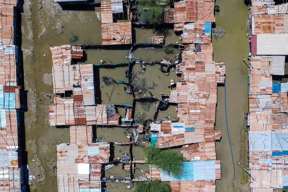 An aerial view of flooded houses at the