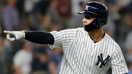 Yankees second baseman Gleyber Torres reacts after hitting