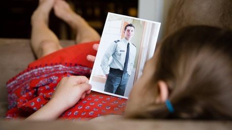 Anaisa Reidel, 4, with a portrait of her