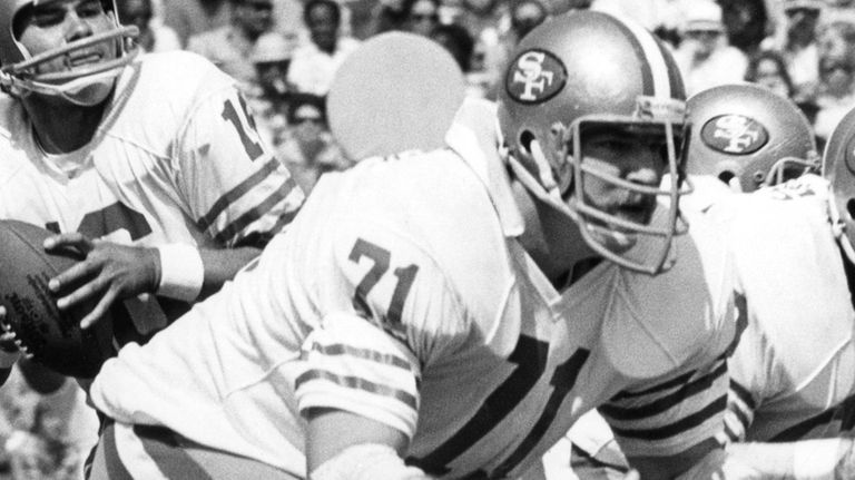 San Francisco 49ers tackle Keith Fahnhurst blocks for