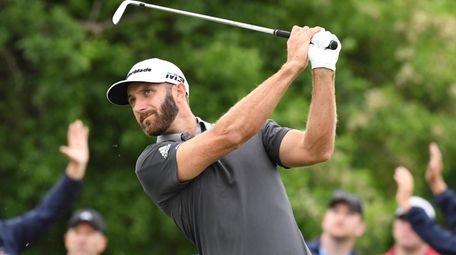Dustin Johnson tees off on 11 during the