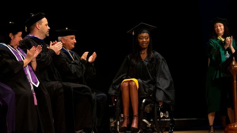 Students walk the stage during the SUNY Empire