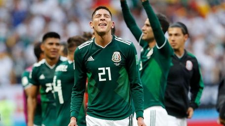 Mexico players celebrate after defeating Germany at the