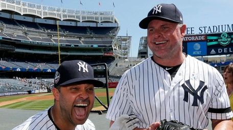 Nick Swisher has a laugh with Jason Giambi