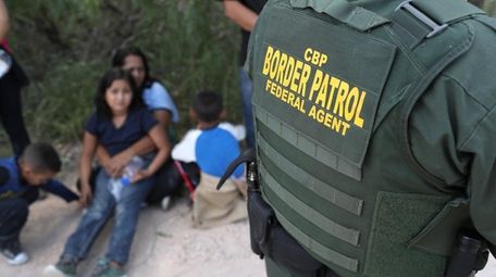 Central American asylum seekers wait as U.S. Border